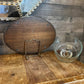 Vintage oval wooden charcuterie board with clear glass dome