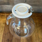 Vintage clear glass pitcher with white plastic lid