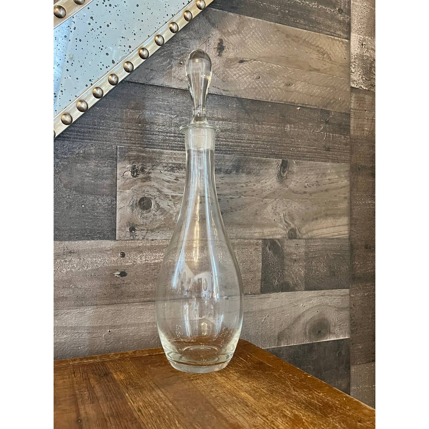 Sleek tall clear glass decanter and stopper